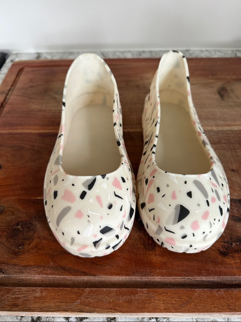 UGG Cream Terrazzo Slip-On boot coverings with Pink & Black Accents.